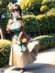 A woman in a kimono walking down a path in a park.